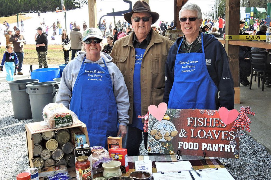 3 volunteers at Fishes & Loaves Food Pantry Canned Food Drive